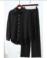 Black button down shirt with black flapper trouser